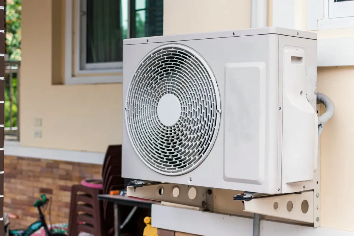 Outdoor heat pump unit on a wall bracket